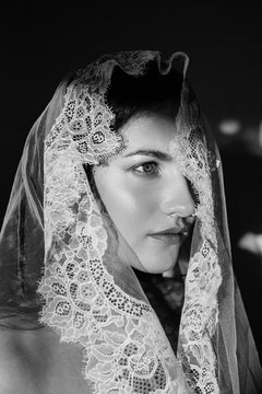 Monochrome portrait of bride under the veil