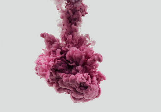 Bright pink ink cloud in water