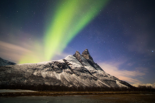 Aurora borealis above Otertinden mountain. Norway.