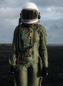 Pilot standing in desert area