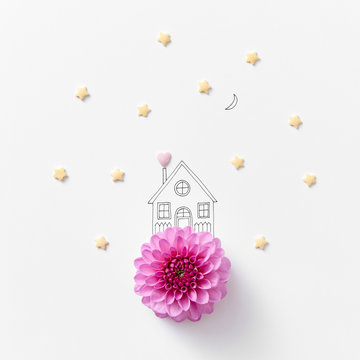 Natural pink flower drawn in a linear handle with a house around
