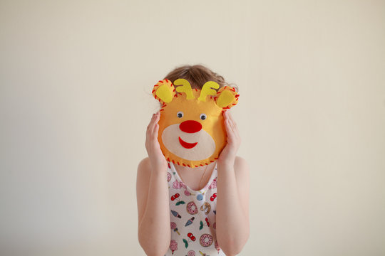 Child with mask of animal