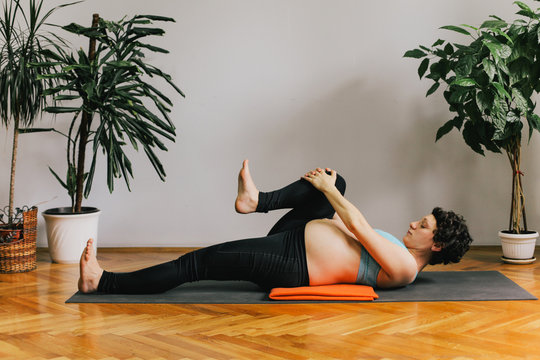 Pregnant woman practicing yoga