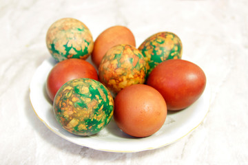 Colorful Easter Eggs On White Plate Placed By Heap