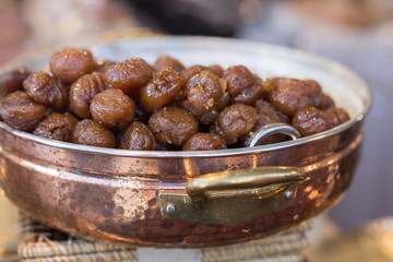 Brown Candied Chestnuts inside Copper Bowl: Food Theme