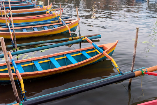Colorful small boats on Bratan Lake in Bedugul, Bali