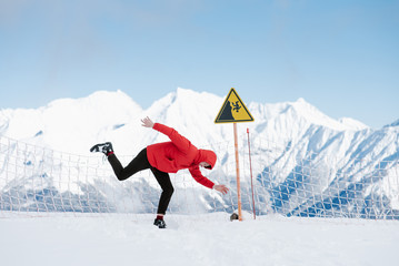 Man showing funny pose from warning sign