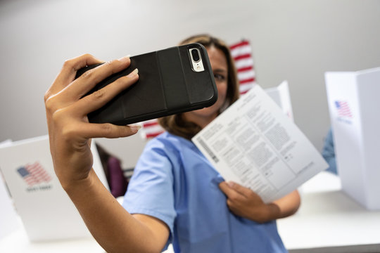 Election: Woman Takes Selfie With Ballot At Polling Location