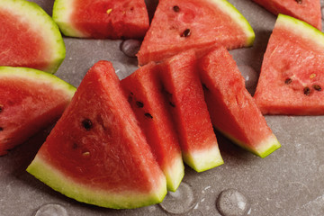 Sliced pieces of watermelon, chilled with ice, refreshing summer berry.