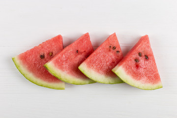 Sliced pieces of watermelon, chilled with ice, refreshing summer berry.