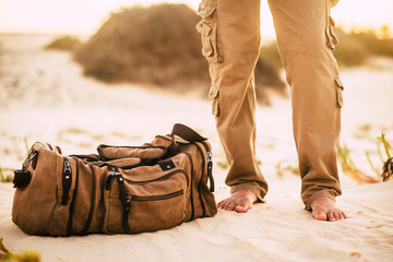 Man with brown basket at the beach