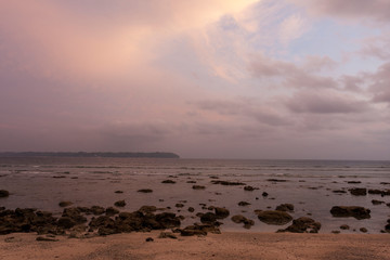 Fototapeta na wymiar Rocky and sandy beach on Andaman islands at sunset