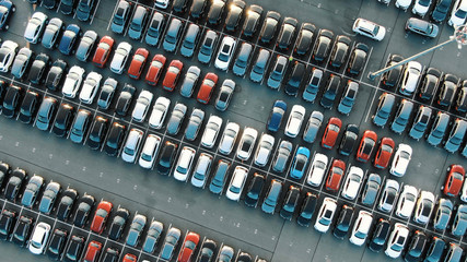 tight coloured car rows on parking area vertical upper view - obrazy, fototapety, plakaty