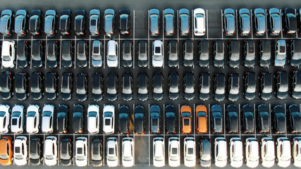 coloured vehicle rows on storage area with white marking