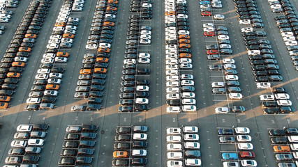 Fototapeta na wymiar different car rows parked on finished auto warehouse area