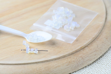 Colorful beads on a wooden surface. Various of shapes and colors to make jewelry