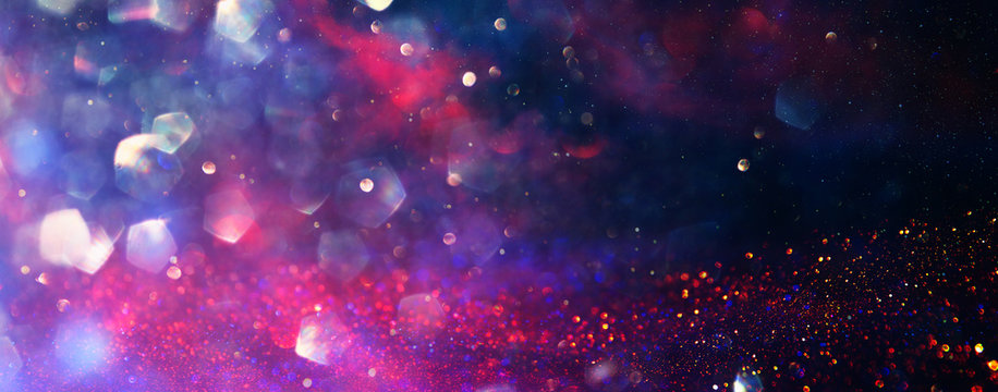 background of abstract red, gold and purple glitter lights. defocused. banner © tomertu