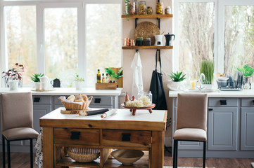 bright cozy kitchen with windows, kitchen tools