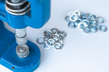 Close up hand press eyelet machine and eyelets details