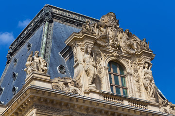 Fototapeta na wymiar PARIS, FRANCE - JUNE 23, 2017: Gable of the Pavillon Colbert of the Louvre. Is the world largest art museum and is housed in the Louvre Palace, originally built in the late 12th to 13th century.