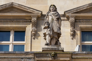 Obraz premium Jean-Baptiste Colbert (1619-1683) statue on the Louvre Palace, Paris, France. He was a French politician who served as the Minister of Finances of France 1661-1683 under the rule of King Louis XIV.