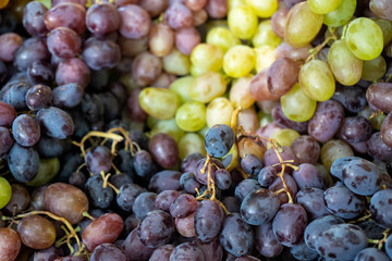 Black and green grapes in the market place