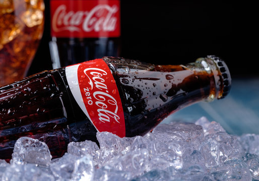 MINSK, BELARUS-AUGUST 16, 2015: Classic Bottle of Coca-Cola Zero on the ice over dark background