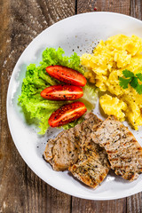 Grilled pork chops with mashed potatoes and vegetables