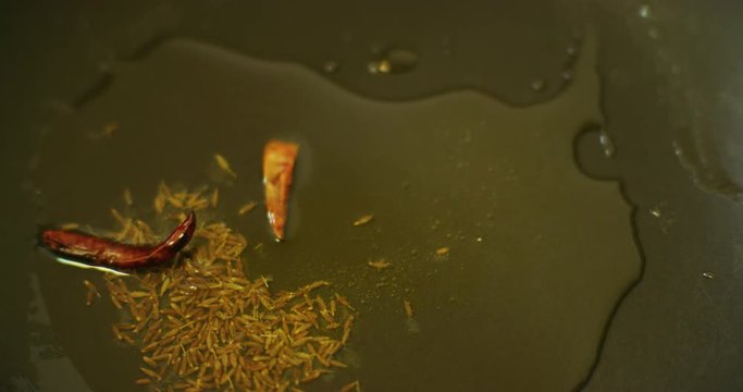 Slow motion shot of cooking a simple and easy vegetarian curry.