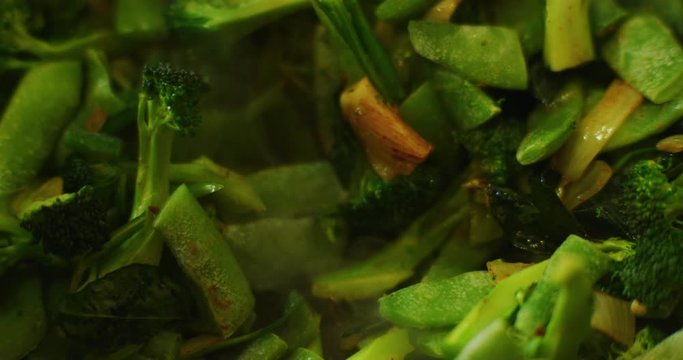 Slow motion shot of cooking a simple and easy vegetarian curry.