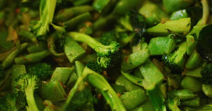 Slow motion shot of cooking a simple and easy vegetarian curry.