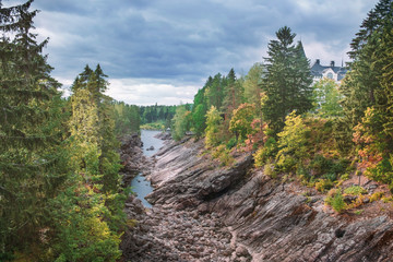 Stone canyon and castle on the Vuoksa River, in the city of Imatra in Finland, nature reserve in autumn