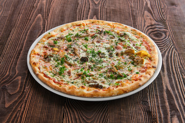 Thin crust pizza with ham, pumpkin and oyster mushrooms
