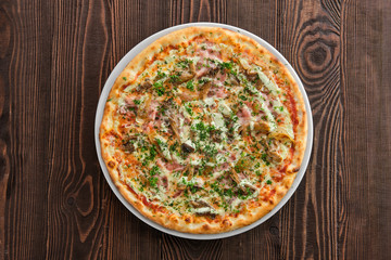 Thin crust pizza with ham, pumpkin and oyster mushrooms