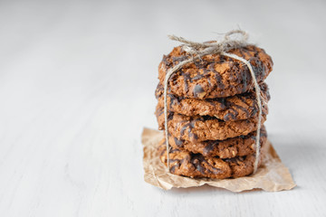 Delicious chocolate chip cookies on white table background. Copy, empty space for text