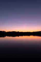 Fototapeta na wymiar colorful sunset at a lake