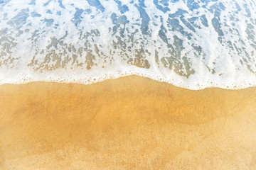 Beach sand and ocean or blue sea wave with foam, can be used for marine background