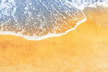 Beach sand and ocean or blue sea wave with foam, can be used for marine background