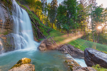 Tropic and beautiful waterfall with sunbeams