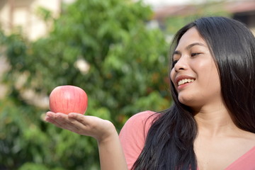 A Female And Happiness With Fruit