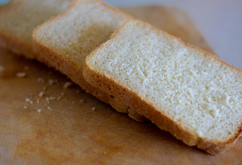 Pieces of bread on the cutting Board. Sliced bread. Isolated on white. Pieces of bread on the table