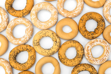 Food background of dried bagels on white. Top view.