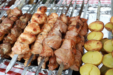 Various meat and potato kebabs on skewers