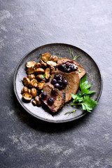 Slow cooked beef with mushrooms and blueberry sauce