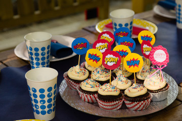 Party cupcakes, sweet desserts with sugar topping and cartoon voice signs.