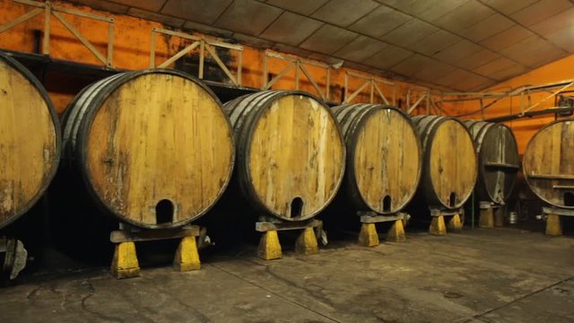 Inside view of Asturian Sidreria with wooden cider barrels