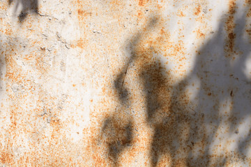 Shadow pattern on rusty, old iron surface