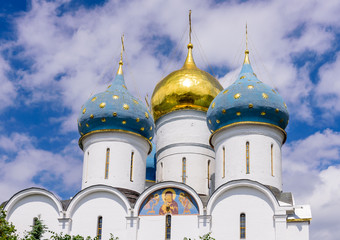 The dome of the Orthodox Cathedral against the blue sky. The Holy Trinity - St. Sergius Lavra in Sergiev Posad near Moscow, Russia, tourist attraction as a part of the Golden Ring of Russia.