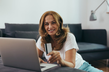mature woman shopping online from her home