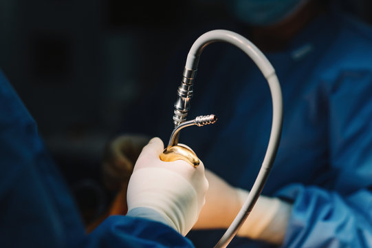 Unrecognizable doctor making surgery with instruments and crop nurse